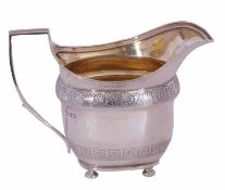 George III silver milk jug of oval bellied form with two bands of bright cut engraving and reeded
