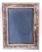 Queen Elizabeth II silver photograph frame of rectangular form, fitted with an easel back,