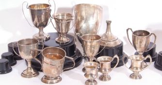 Group of nine assorted hallmarked silver trophy cups and a further example stamped "silver", various