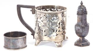 Mixed Lot: silver glass holder together with single napkin ring and single pepper caster, combined