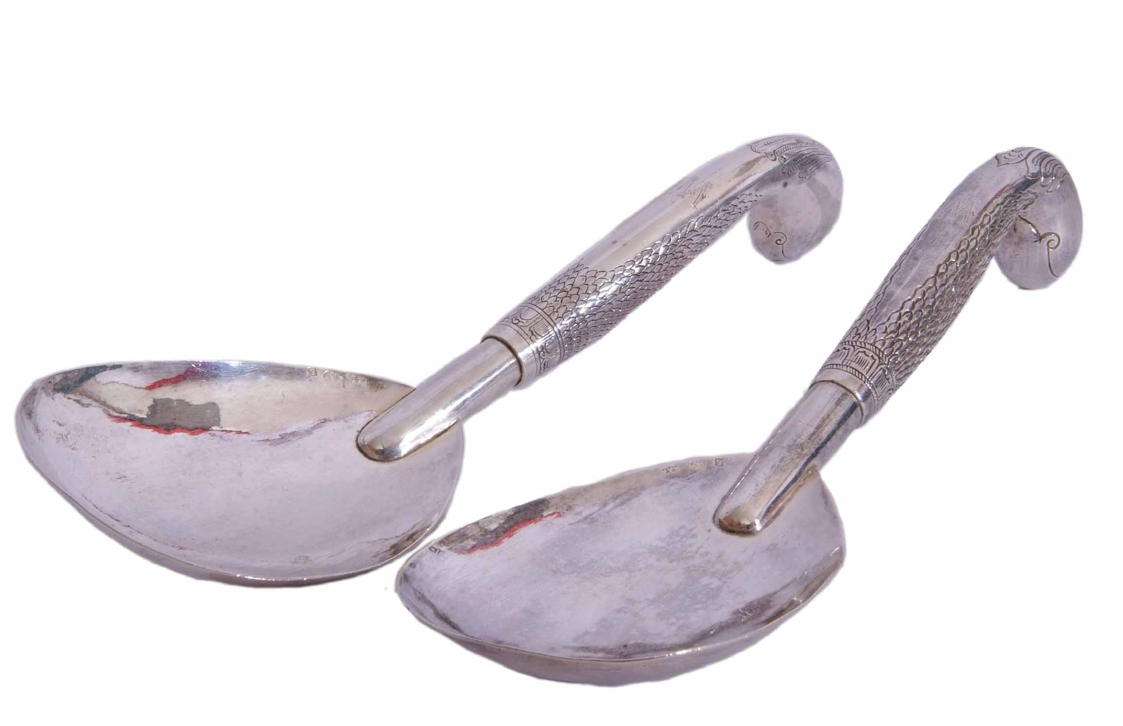 Pair of large Continental white metal serving spoons, with large shaped oval bowls to chased and - Image 2 of 2