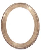 George V silver mounted photograph frame of polished oval form with contemporary initials and oak