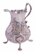 Early George III pear shaped cream jug with card cut rim, double scroll handle supported on four