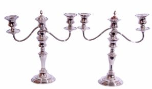 Pair of silver plated twin branch candelabra with detachable sconces and urn finials, beaded