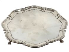 Atkin Bros silver plated salver with Chippendale border and monogrammed engraved centre, supported