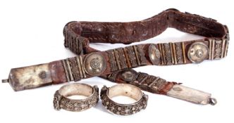 Mixed Lot: two Middle Eastern white metal bangles, each with stylised floral and filigree detail