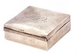 Early 20th century silver table cigarette box of square form, the hinged lid with engraved