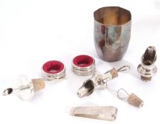 Mixed Lot: A 925 stamped wine pourer, two white metal napkin rings