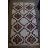 GEOMETRICALLY PATTERNED BEDSIDE RUG, APPROX 130 X 70CM