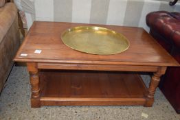 HARDWOOD COFFEE TABLE WITH AN INSET BRASS TRAY