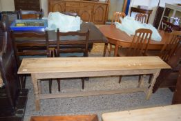 WAXED PINE BENCH RAISED ON A JOINTED BASE RAISED ON TURNED LEGS WITH CARVED FRIEZE, LENGTH APPROX