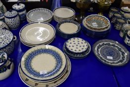 POTTERY PLATES WITH FLORAL DESIGNS