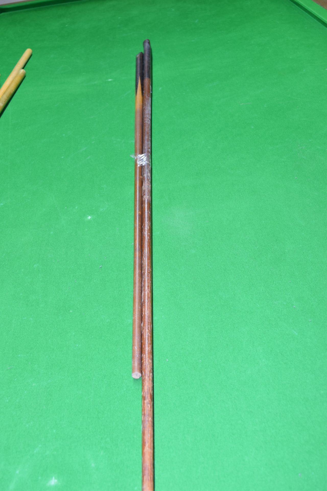 Two vintage snooker cues