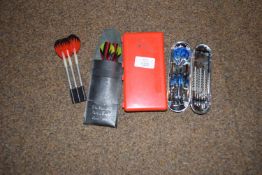 Four sets of darts