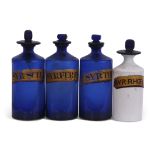 Group of four mid-19th century chemists drug jars, three blue glass with gilt titles and a further