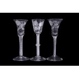 Group of three 18th century wine glasses with air twist and opaque twist stems, one with double