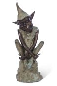 Contemporary patinated bronze figure of a pixie seated on a rock, 23cm wide x 34cm deep x 76cm tall