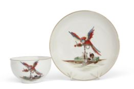 Meissen tea bowl and saucer, mid-18th century, well painted with an unusual scene of a parrot on a