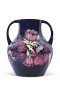 Large Moorcroft modern vase with loop handles and original box, the vase decorated with tube lined