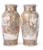 Large pair of Satsuma vases decorated in typical fashion with Japanese dignitaries within a