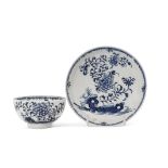 Lowestoft porcelain tea bowl and saucer decorated in underglaze blue with rock work and trailing
