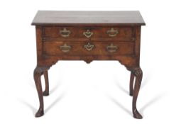 George II period mahogany low boy having a cross banded top, two drawers to frieze with brass swan