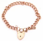 Plain hallmarked 9ct gold curb link bracelet with padlock, 18cms long, weight 21gms