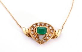 Emerald and diamond pendant necklace of shield shape, centring a step cut emerald, 5 x 3mm, within a