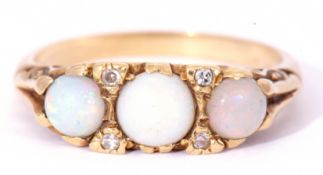 18ct gold opal and diamond ring featuring three graduated round cut cabochon opals, with four
