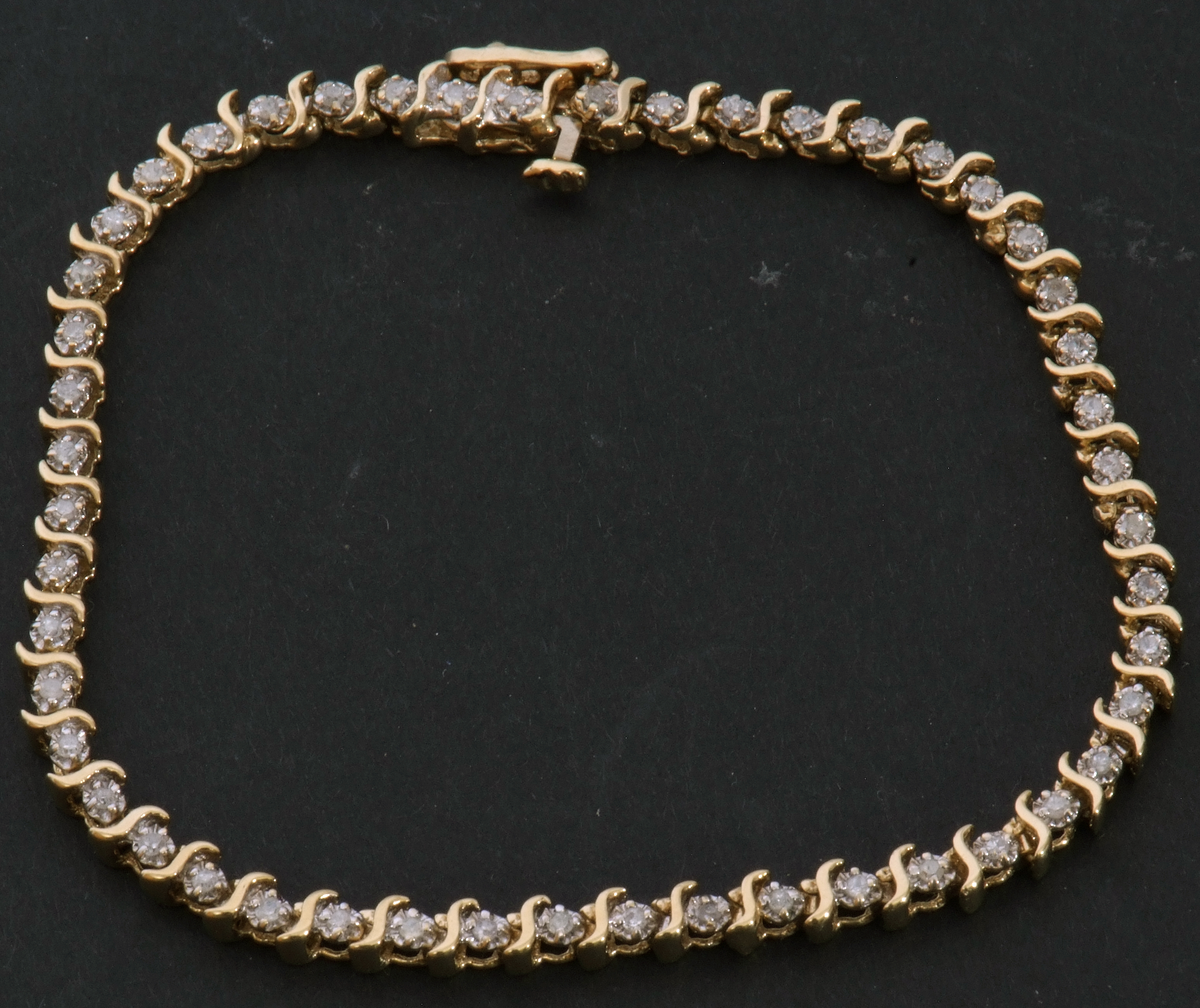 Diamond "tennis" bracelet featuring 49 small diamonds, individually claw set between S-links, - Image 8 of 9