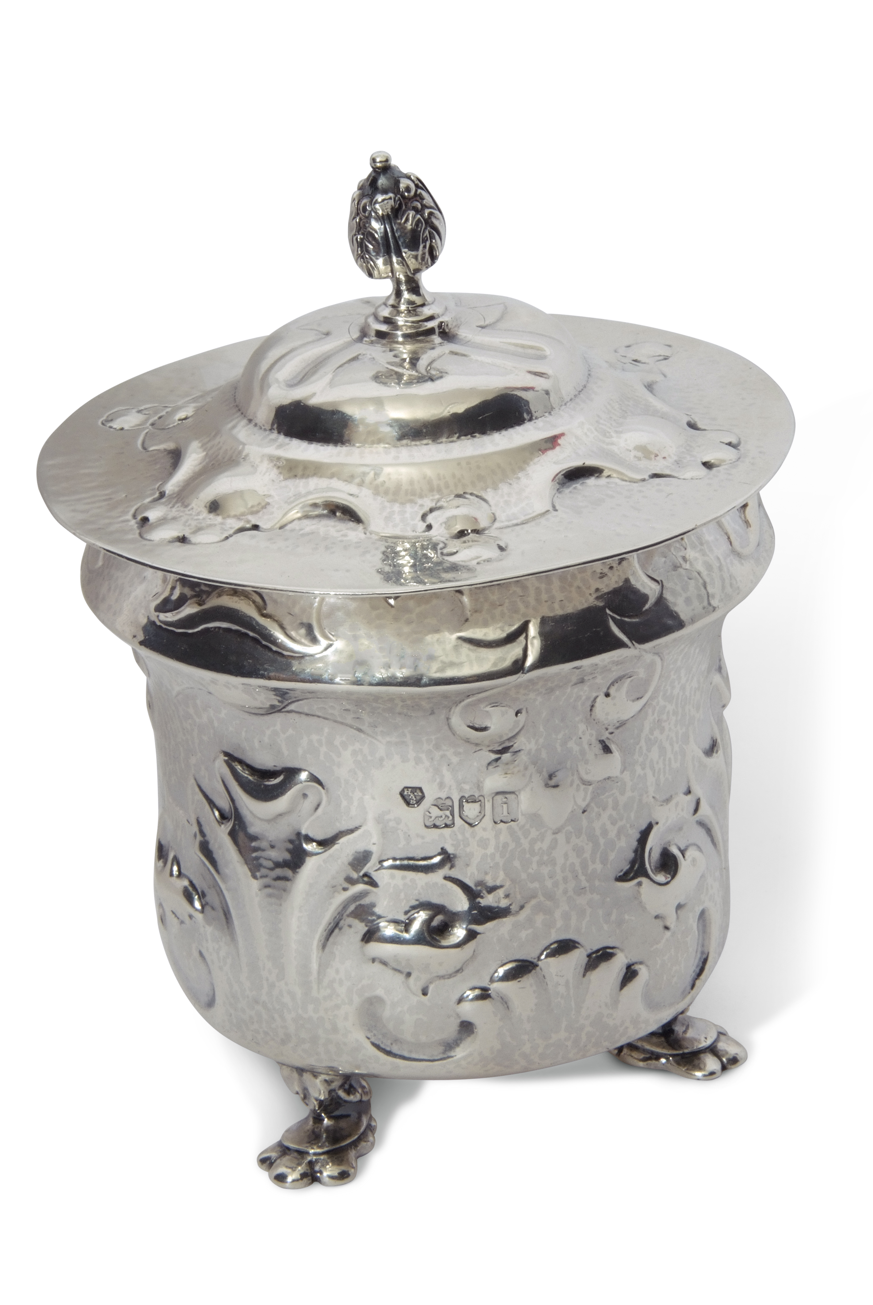Art Nouveau silver tea caddy, the hammered body embellished with scrolling organic decoration and