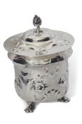 Art Nouveau silver tea caddy, the hammered body embellished with scrolling organic decoration and