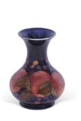 Moorcroft vase in the Pomegranate pattern, green signature to base, 13cm high