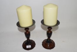 PAIR OF WOODEN CANDLESTICKS AND LARGE CANDLES