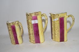 GRADUATED SET OF THREE POTTERY JUGS