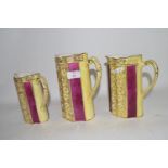 GRADUATED SET OF THREE POTTERY JUGS