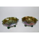 TWO CARNIVAL GLASS DISHES WITH A LEAF AND BERRY DESIGN, RAISED ON THREE FEET (2)