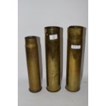 THREE MILITARY BRASS SHELL CASES