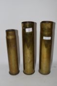 THREE MILITARY BRASS SHELL CASES