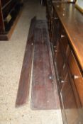 TWO LONG VINTAGE LENGTHS OF TIMBER, PRESUMED TO BE A SCHOOL BENCH AND LONG SCHOOL DESK, APPROX