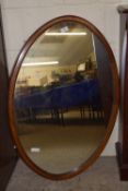 EDWARDIAN OVAL OVERMANTEL MAHOGANY FRAMED MIRROR WITH STRUNG DECORATION, TOTAL SIZE APPROX 92 X