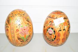 PAIR OF CERAMIC EGGS MODELLED IN CLOISONNE STYLE