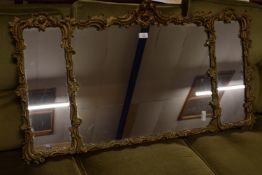 ORNATELY DECORATED THREE PANEL GILT GESSO OVERMANTEL MIRROR, APPROX 114 X 64CM MAX