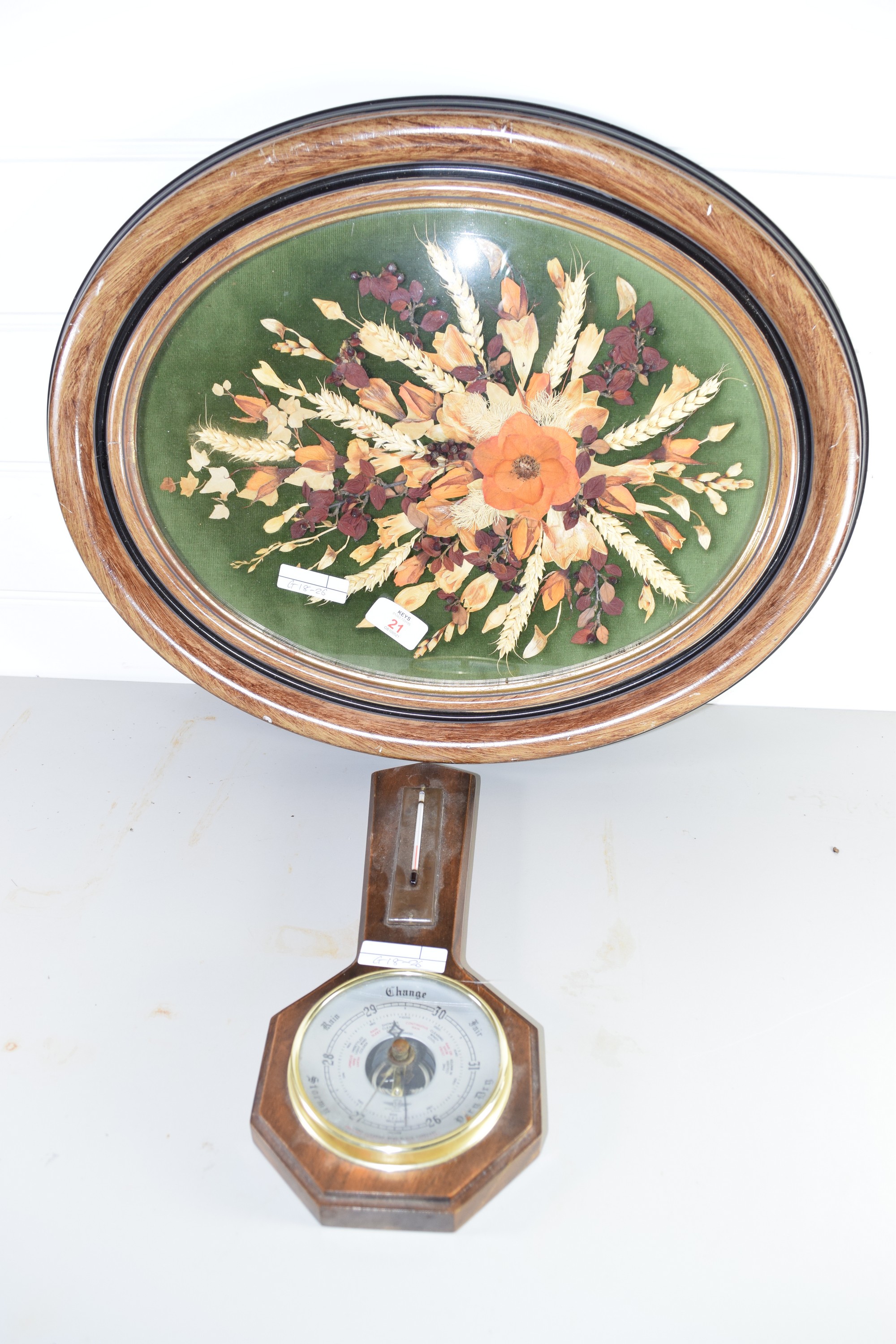 COLLAGE OF FLOWERS IN OVAL METAL FRAME, TOGETHER WITH A SMALL BAROMETER AND THERMOMETER