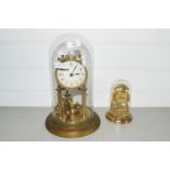 TWO CLOCKS IN GLASS DOMES