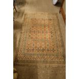 RUG DECORATED WITH GEOMETRIC SHAPES WITHIN A CENTRAL PANEL, APPROX 173 X 116CM