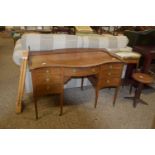 SERPENTINE DRESSING TABLE OR DESK, RAISED ON TAPERED FEET, WIDTH APPROX 119CM
