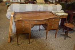 SERPENTINE DRESSING TABLE OR DESK, RAISED ON TAPERED FEET, WIDTH APPROX 119CM