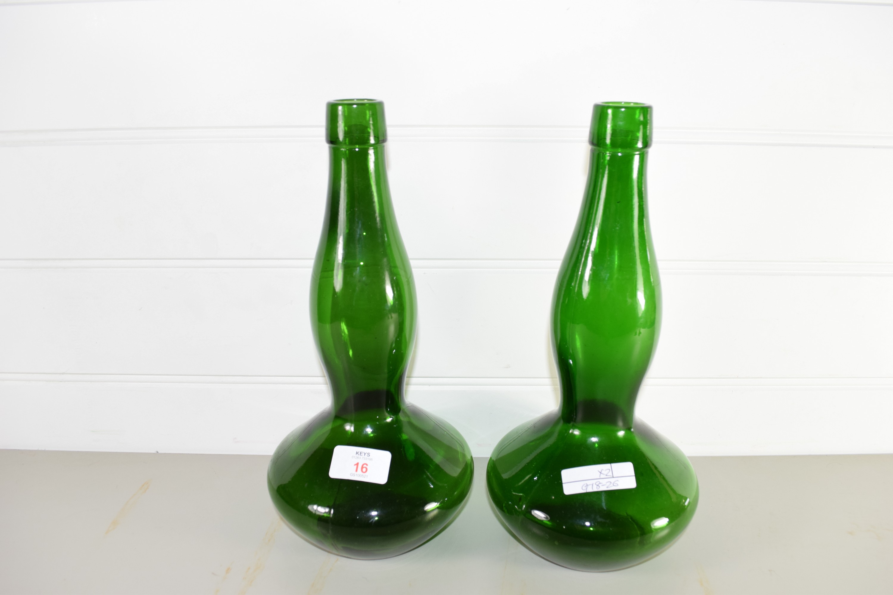 TWO GREEN GLASS BOTTLES, REG NO 910569