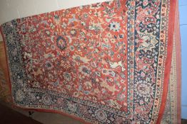 LARGE PREDOMINANTLY RED GROUND CARPET WITH VARIOUS FLORAL AND ANIMAL DECORATION, SIZE APPROX 217 X